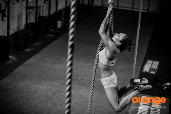 Tracey rope climbing during CrossFit training