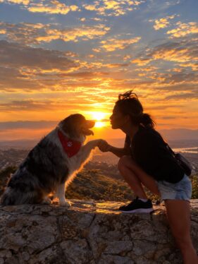 Tracey sharing a sunset moment with one of her dogs